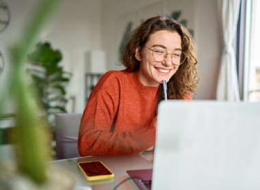 Smiling person at laptop (1).jpg