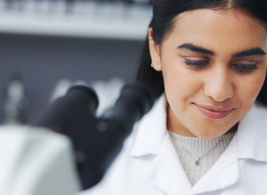 Scientist at microscope.jpg