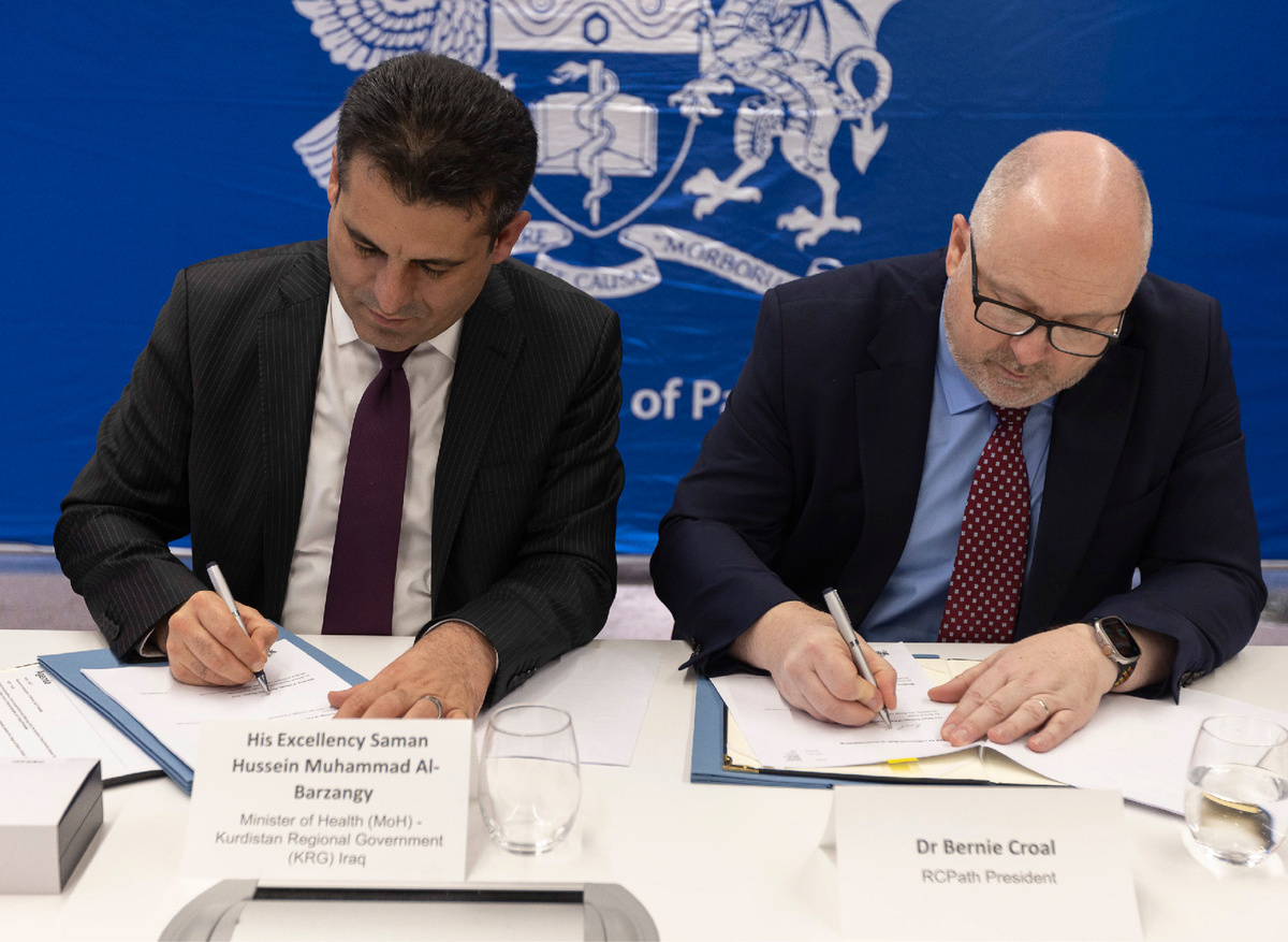 Dr Bernie Croal and His Excellency signing the MoU
