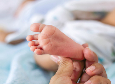 Baby foot being held-sm.jpg