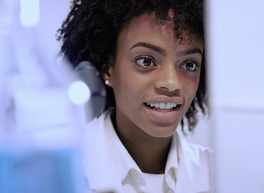 Women researcher looking at computer in lab.jpg