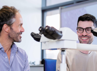 The-Royal-London-Hospital-Students looking into microscope.jpg