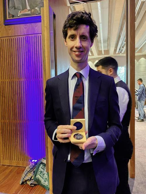 Dr Philip Macklin presents his Silver Research Medal