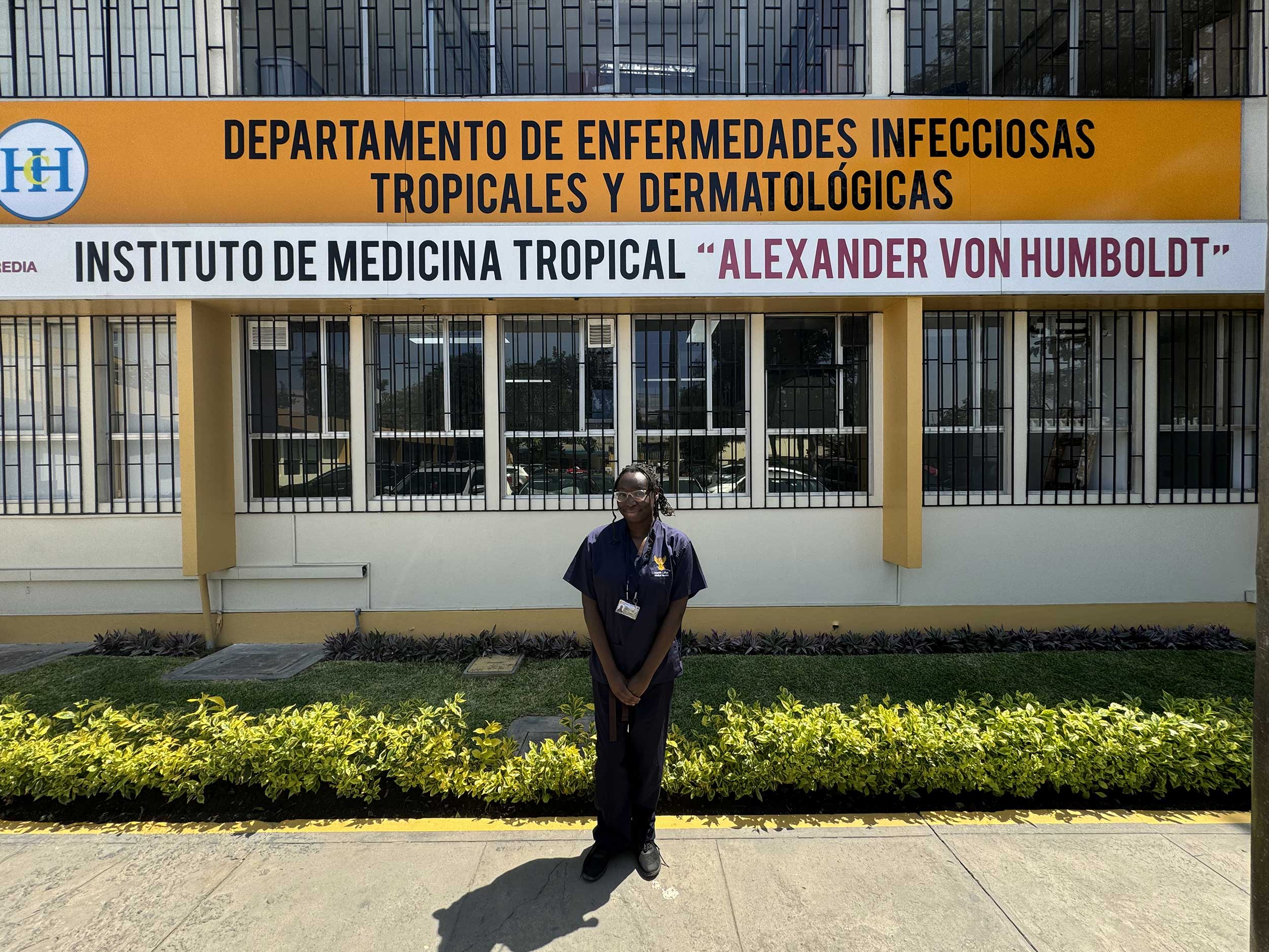 Ayolola Eni-Olotu BSc (Hons), final year medical student at Imperial College London, standing in front of the Tropical and Dematological Infectious Diseases at Alexander von Humboldt Tropical Medicine