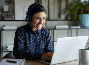 Person at laptop on a meeting square image.jpg