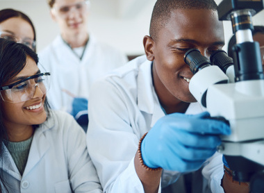 Trainees looking down a microscope stock image_low res.jpg