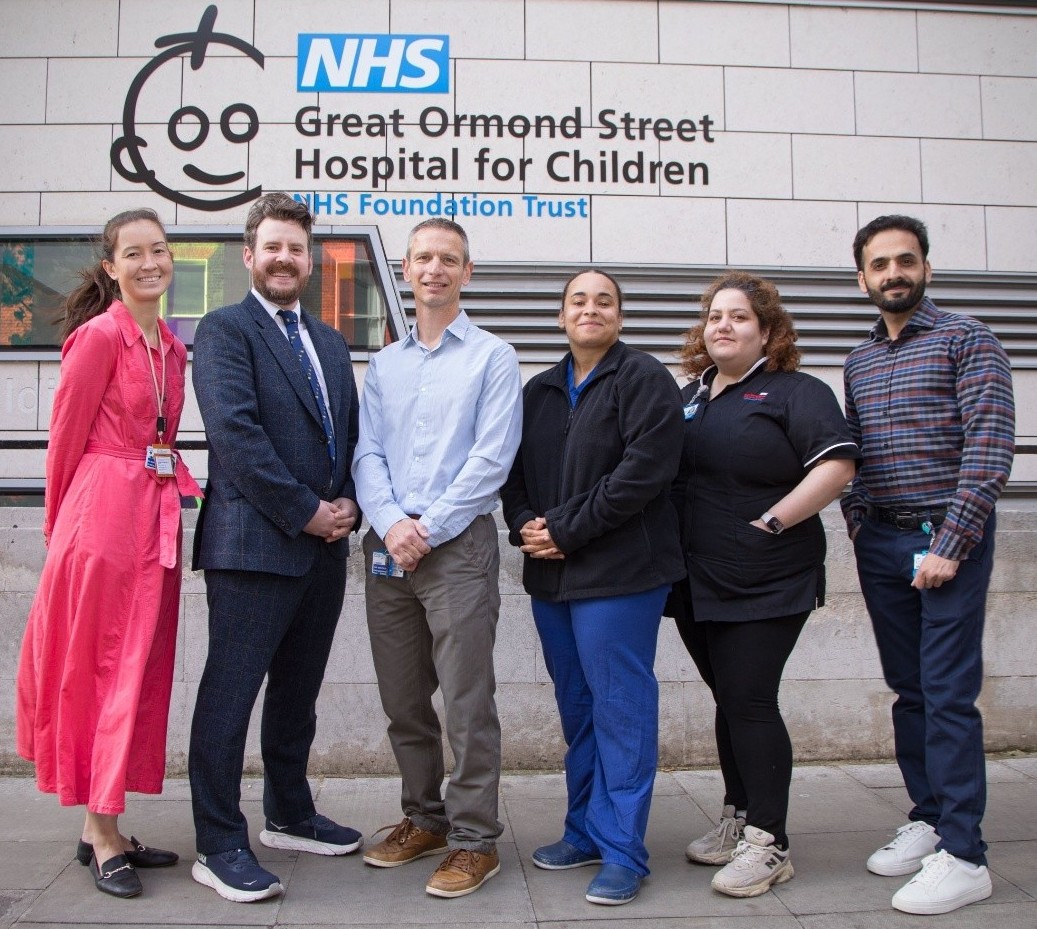 Great Ormond Street Hospital perinatal autopsy imaging service team in front of the GOSH building.