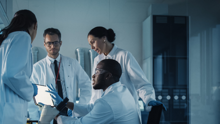 Group of doctors talking cropped.png