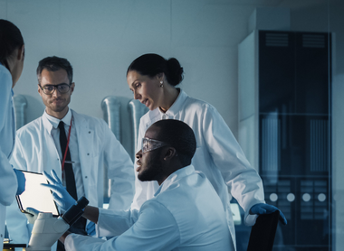 Group of doctors talking cropped.png