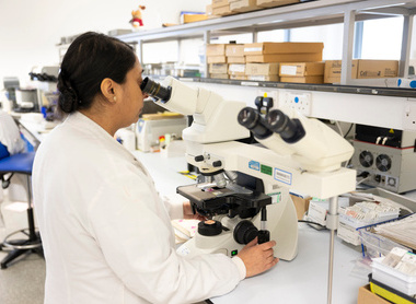 Student working with a microscope in the Histopathology Lab at Leeds Hospital