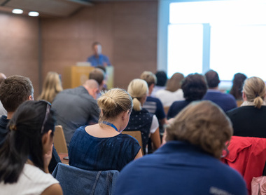 Training conference with speaker at the front.jpg